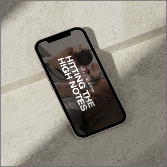 Phone with "Hitting the high notes" on it