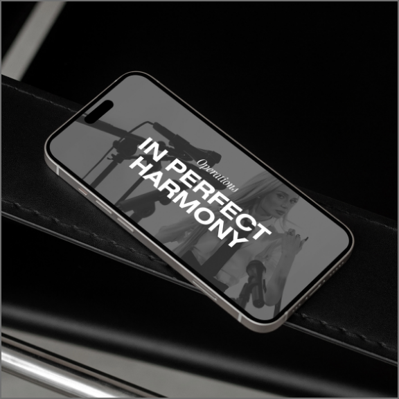 Phone with "In perfect harmony" on it